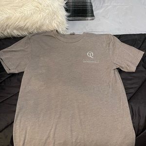 just a comfy tan done graphic t